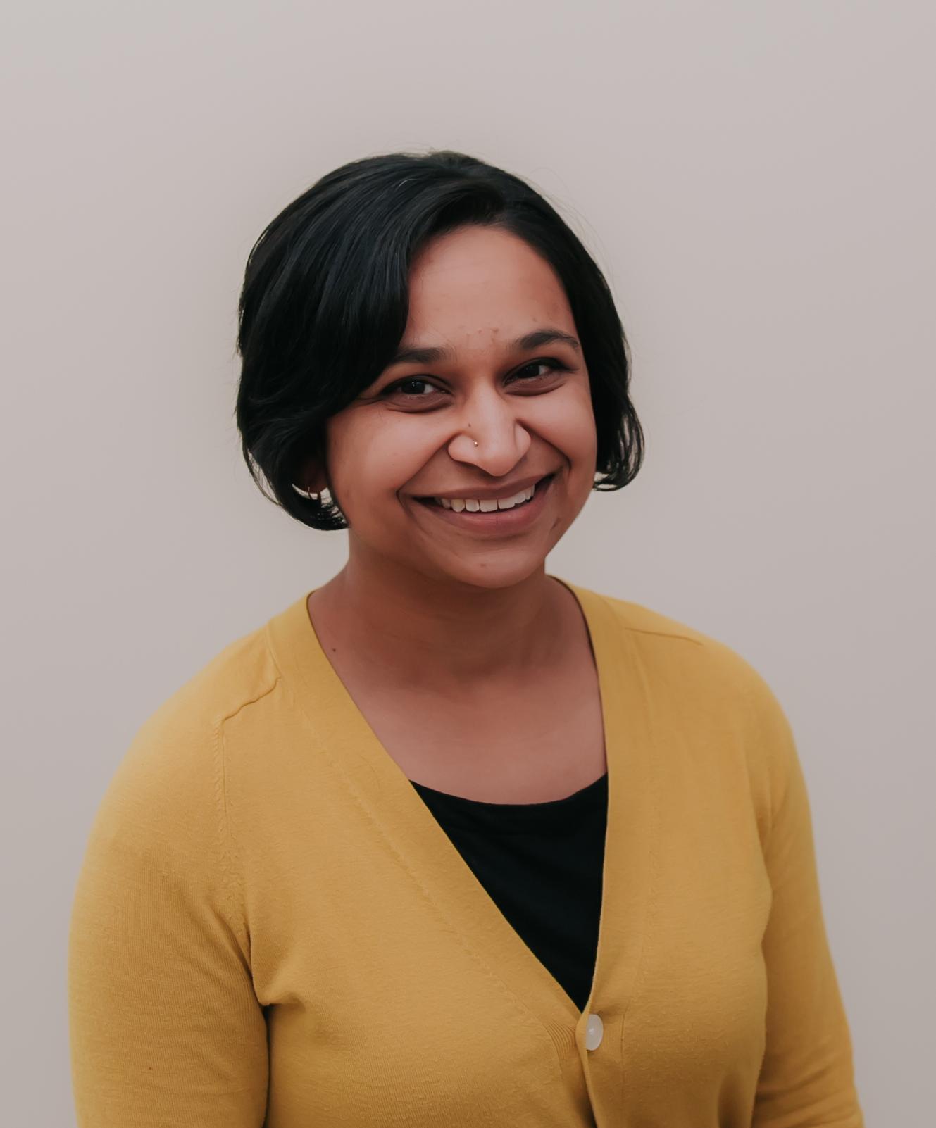 Professional headshot of Mala Misra